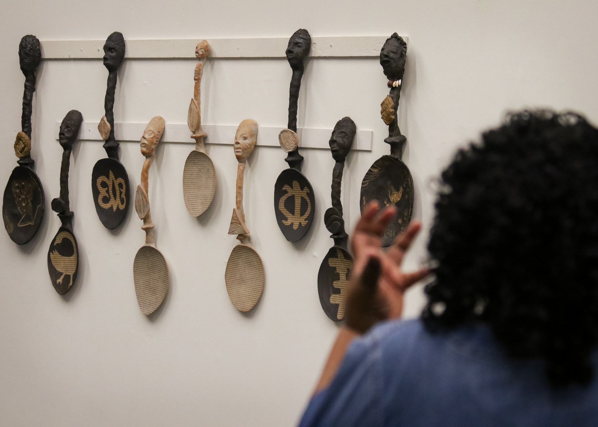 Nine of the fifteen spoons Ray created for the exhibition.