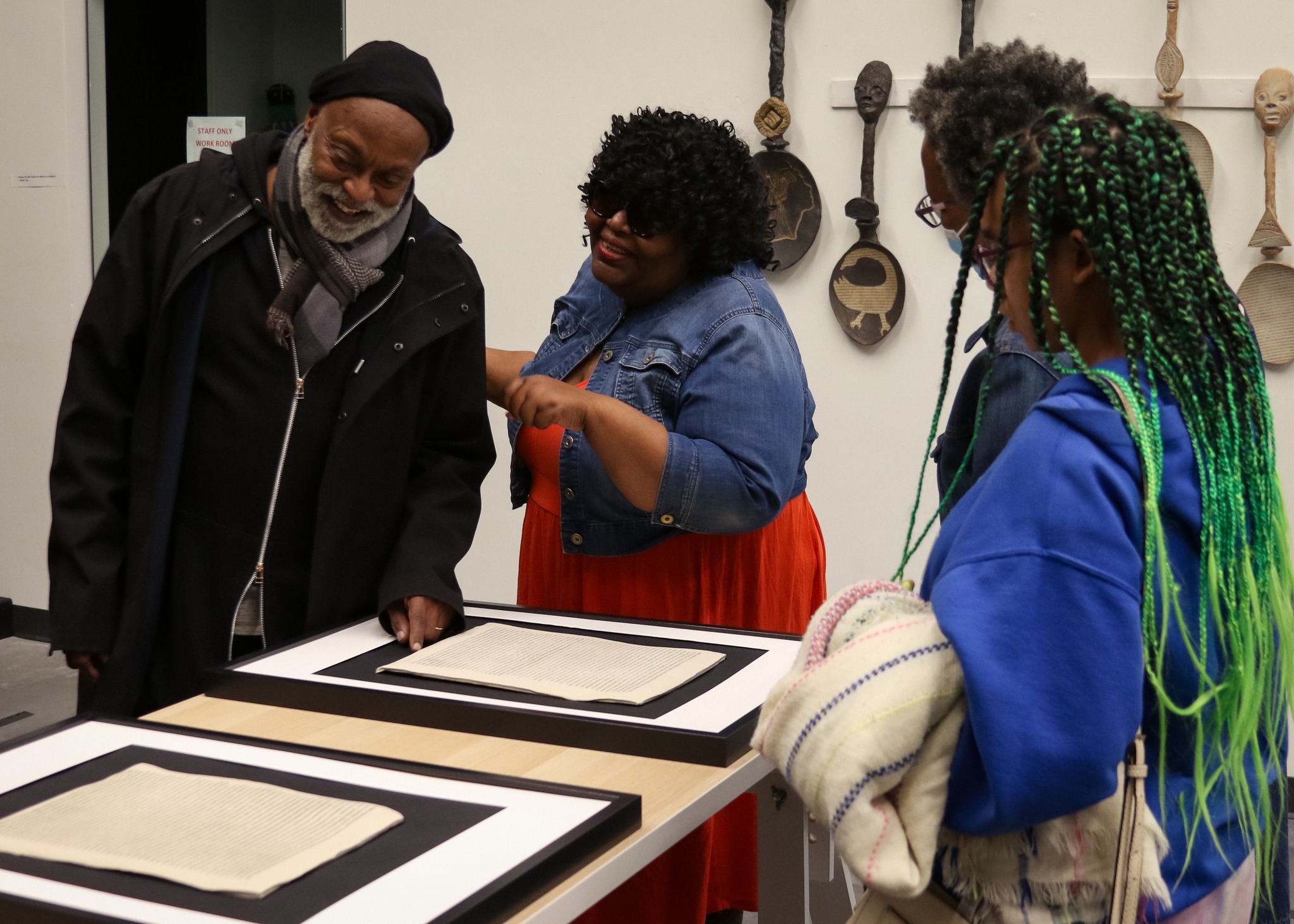Ray discusses her research and theories with visitors at her reception.