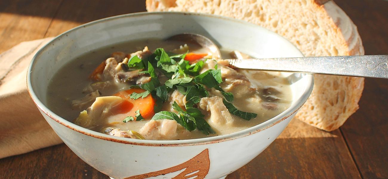 Nathalie Royston, chicken and mushroom soup in brown stoneware bowl, glazed in alpine white, decorated with a leaf design.