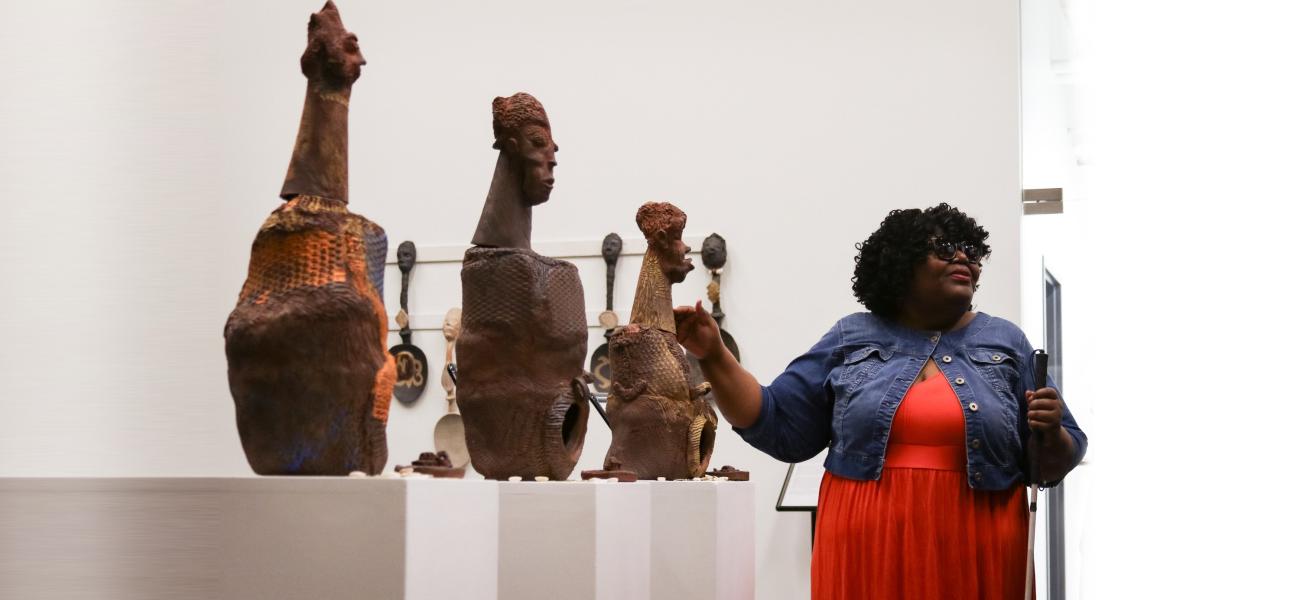 Donna Ray introducing "The Three Goddesses" at her gallery talk.