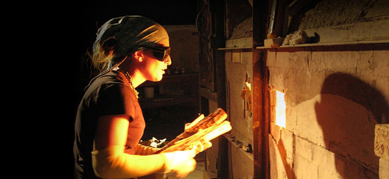 Heidi Kreitchet preparing to stoke the kiln at Pottery West, Las Vegas, Nevada. Photo by Kelly McLendon, 2010.