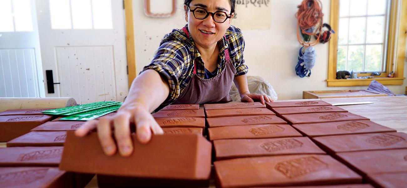  Ayumi Horie works on "Portland" bricks in her studio. Photograph by Janine Grant.