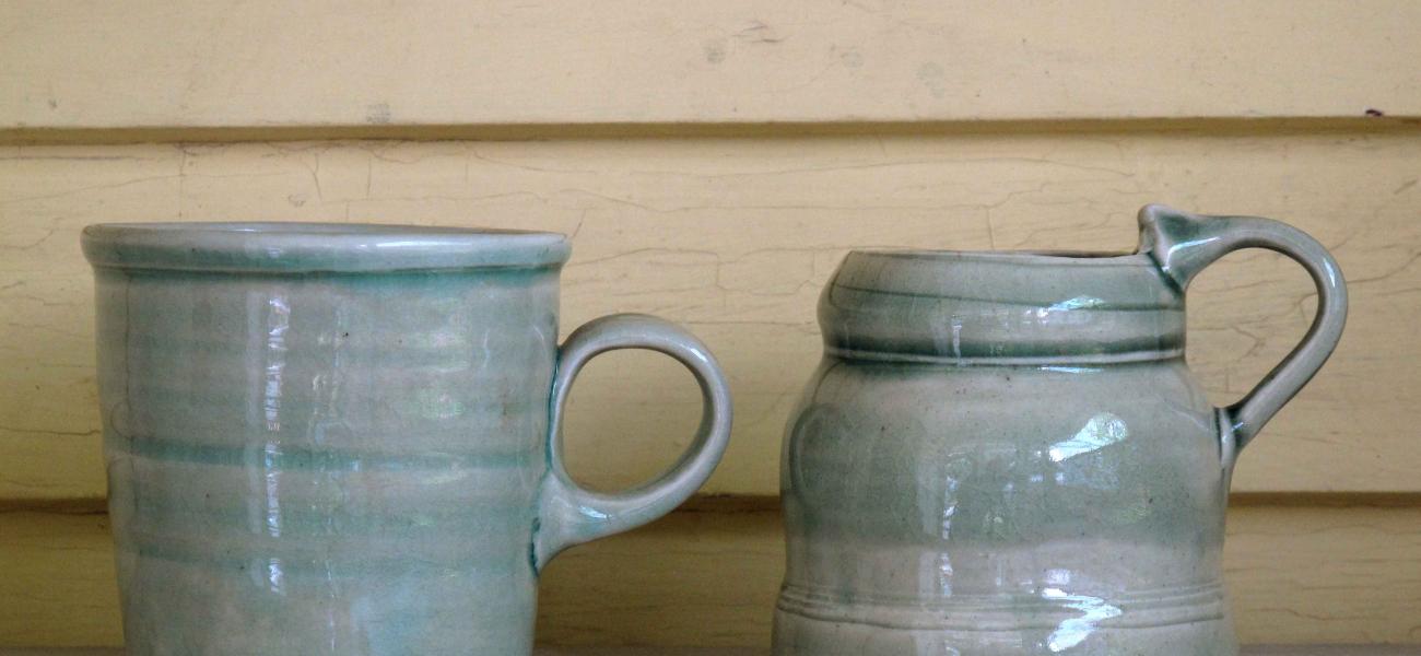 Mugs on a shelf in the author's home. 
