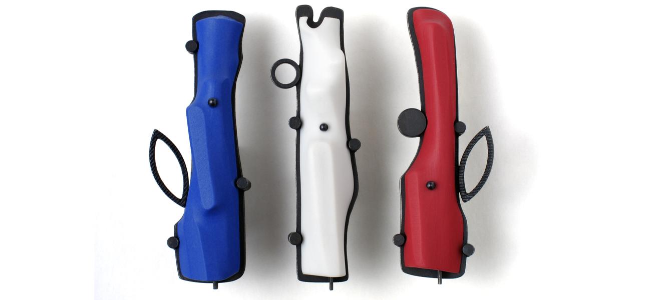 Paul W. Leathers, JDZ (Blue & White; the new Red) Fragment Brooches, 2012. Oxidized sterling silver with slip-cast colored porcelains, 2.5 x 0.75 x 0.5 in. Photograph by the author.