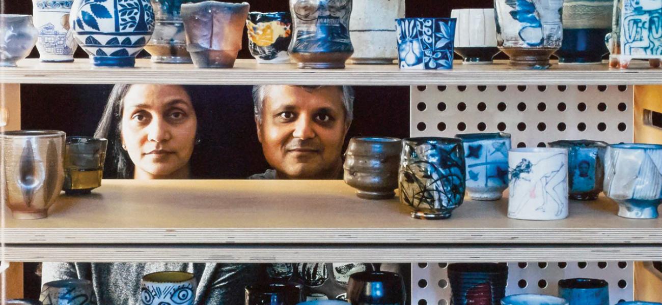 Jigna (left) and Sanjay (right) Jani behind various yunomi in their gallery, Iowa City, Iowa, USA, 2014. 
