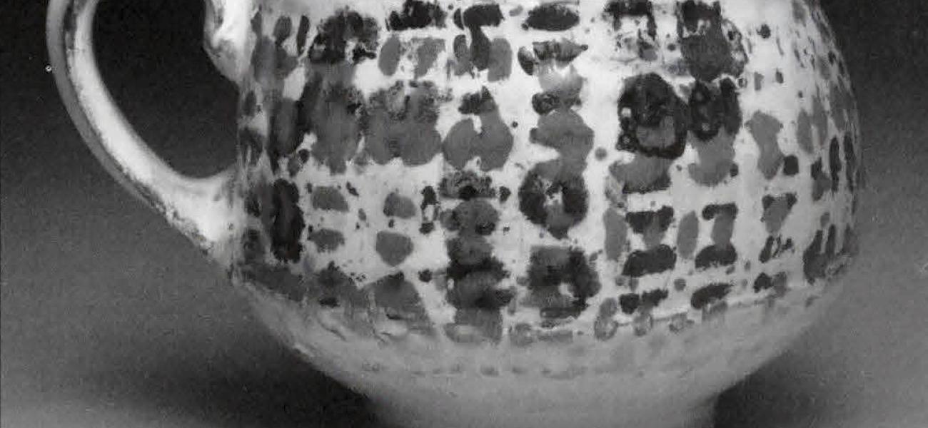 Cup, 2010. Earthenware, slip, toner resist transfer, glaze. 4 x 4 x 4 in.