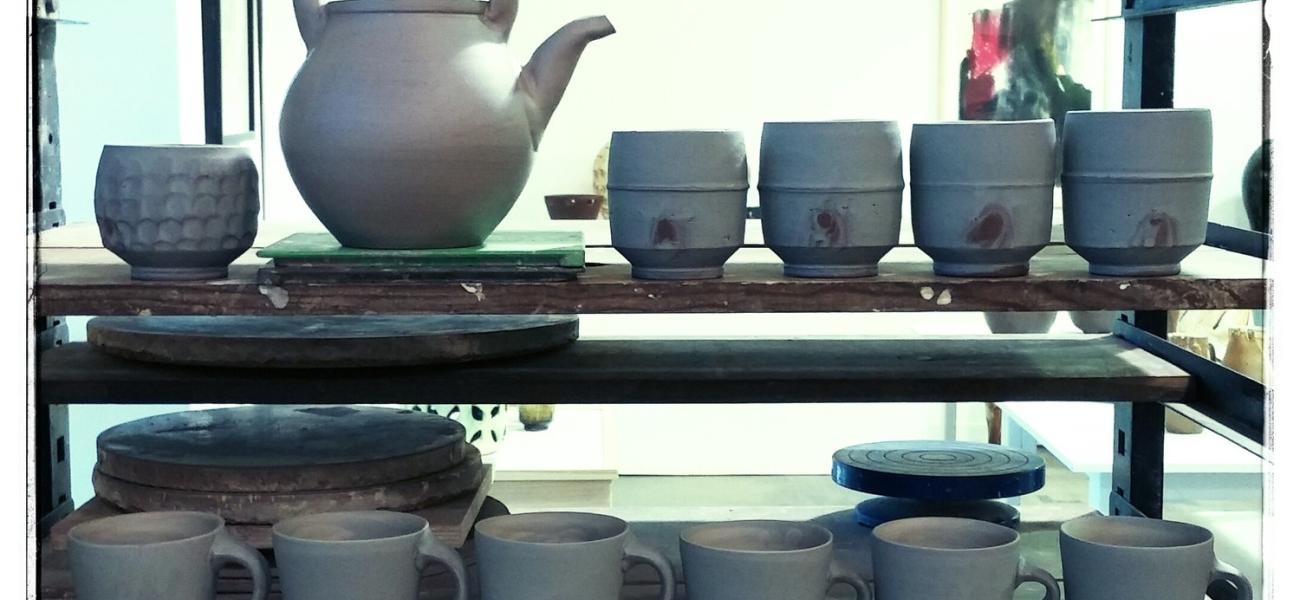 Michael Ashley. Studio shot of greenware pots, red clay with slip, 2016.