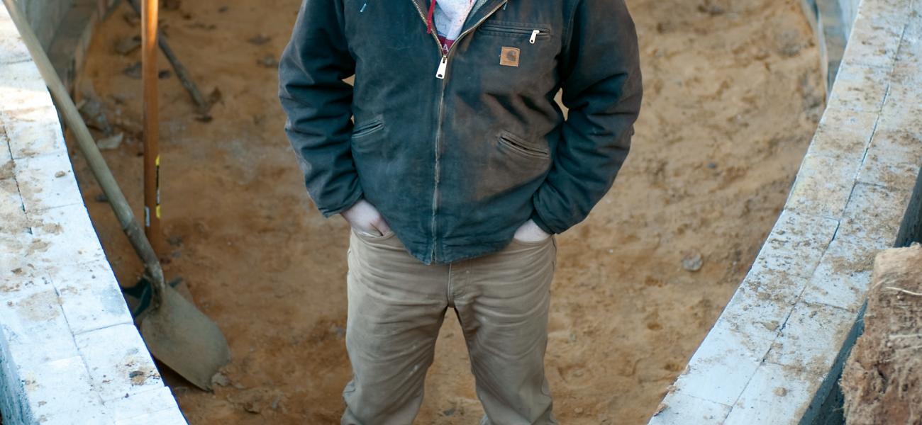 Noah Hughey-Commers starting work on the foundation of his kiln, February 2013. Photo by Stephanie Gross.