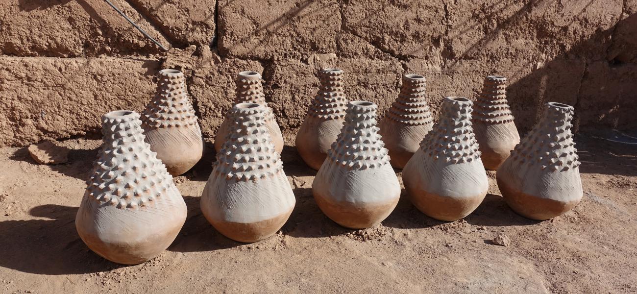 Astour, near Zagora, Oasis region. These unique pieces, nearly 30” high, were commissioned by someone in a big city as decorative pieces in a hotel or mall. The white coating is ash from the fire pit.