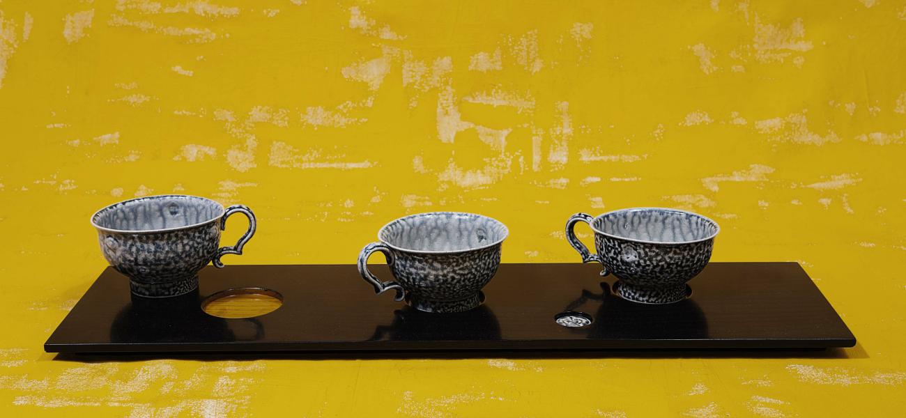 Work from "Cup Board" by Steve Harrison, photograph by Richard Cannon