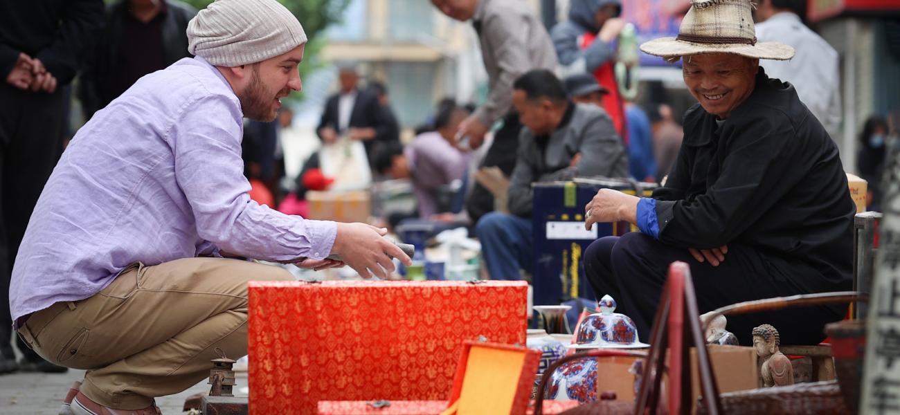 Nick Vest buying two objects at the Ghost Market  to start work with. Photo by Wu Fan