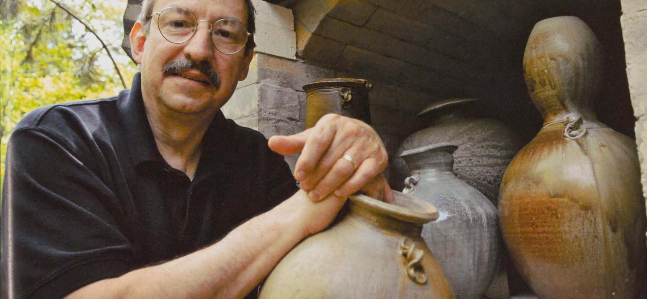 Dick Lehman Unloading Kiln, 2010. Photograph by Howard Zehr