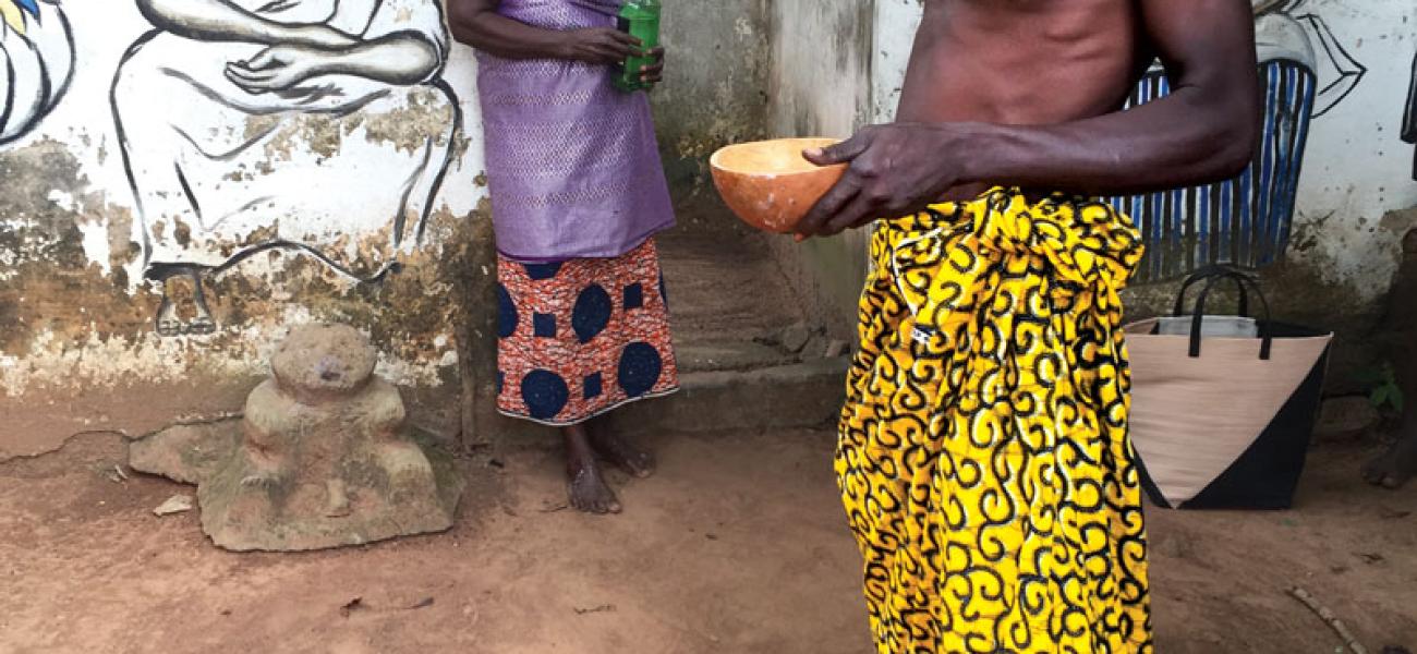 Vodu priest pouring libations, Kuli Village, Volta Region, Ghana.