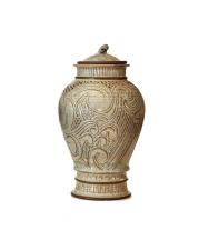 Wave Jar with Lid, 1985. Carved stoneware with celadon-type glass. 17 ½ x 10". Photo courtesy of ServisArts. 