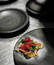 Pottery by Ben Richardson for Garagistes restaurant, Hobart, Tasmania. Culinary arts by Chef Luke Burgess (center, in red). Photograph by Chris Crerar.