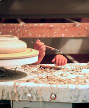 Hands of Amy Smith and her daughter, at the potter's wheel. 