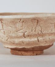 Otagaki Rengetsu: Tea bowl with incised poem. Glazed stoneware, 19th century. Collection of John Fong.
