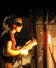 Heidi Kreitchet preparing to stoke the kiln at Pottery West, Las Vegas, Nevada. Photo by Kelly McLendon, 2010.