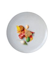 Jane Herold. Dinner Plate, 2015. Stoneware with white glaze, 0.5 x 11 in. Photograph by Signe Birck. Food by Bryce Shuman of Betony.