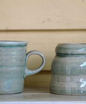 Mugs on a shelf in the author's home. 