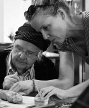 NCC teaching artist Angie Renee assists residents at Martin Luther Meadow Woods memory care facility, 2017. Photograph by Alison Beech.