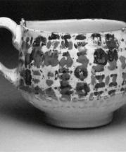 Cup, 2010. Earthenware, slip, toner resist transfer, glaze. 4 x 4 x 4 in.