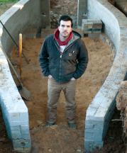 Noah Hughey-Commers starting work on the foundation of his kiln, February 2013. Photo by Stephanie Gross.