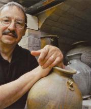 Dick Lehman Unloading Kiln, 2010. Photograph by Howard Zehr