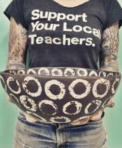 Potter Melissa Weiss holding one of her large bowls. Weiss digs her own clay in Northwest Arkansas, and operates a studio in Asheville, North Carolina.