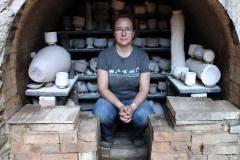 Kristin Muller in her anagama hybrid kiln built in 1995 by Okazaki Takao. Photo by Jacklyn Scott, 2016.